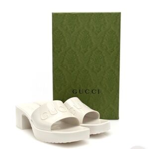 GUCCI Plastique logo-embossed rubber mules in Mystic White